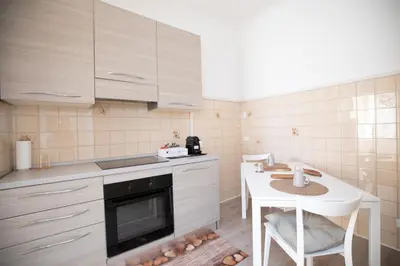 a small kitchen with a table and a stove at CaSa e Caffarella in Rome