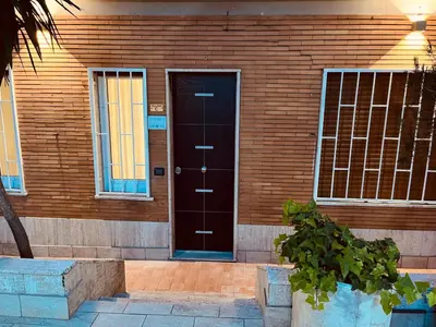 a brown door on the side of a building at Casa Vacanze Leone in Rome