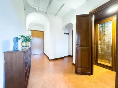 an empty hallway with a door and a room with at Maison Giulia in Rome