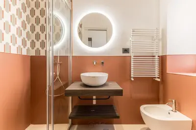 a bathroom with a sink and a mirror at Domina Livia Vaticano Roma - Suite e Room in Rome