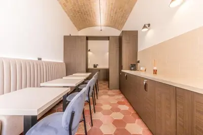 a row of tables and chairs in a restaurant at Domina Livia Vaticano Roma - Suite e Room in Rome