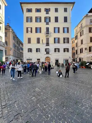 a large group of people walking in a street at Inn Pantheon Home in Rome
