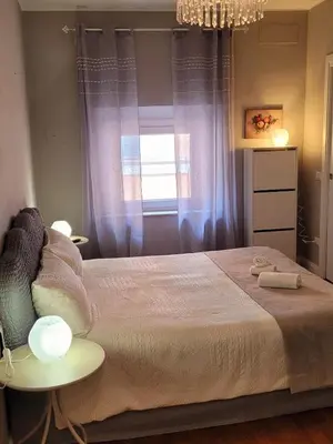 a bedroom with a large bed and a window at Suite Benedict Pantheon in Rome