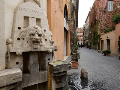 a statue of a lion on the side of a building at Margutta 54 Luxury Suites in Rome