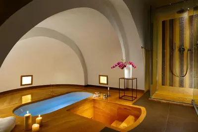 a large bathroom with a tub and a shower at Margutta 54 Luxury Suites in Rome