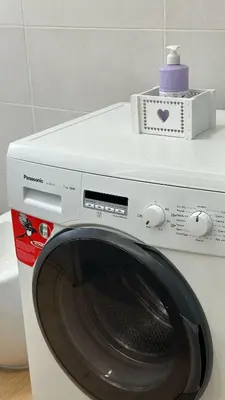 a white washing machine with a box on top of it at Sophia Luxury Home confortevole e in ottima posizione in Rome