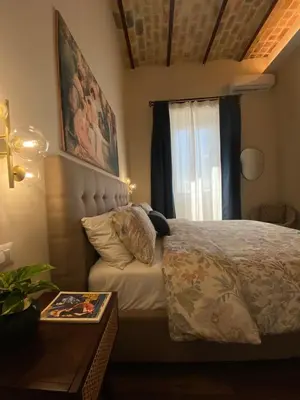 a bedroom with a bed and a window at Talamo Heritage in Rome