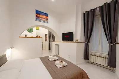 a bedroom with a bed with towels on it at casa cavour in Rome