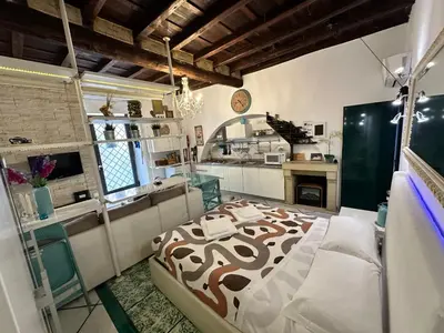 a bedroom with a bed with a cow print on it at Your nest in Trastevere, the heart of Rome - Il vostro Nido nel cuore di Roma in Rome