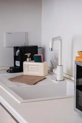 a kitchen counter with a blender and a coffee maker at Stylish 1BR, 2BATH Apartment Castel Sant'Angelo 6A in Rome