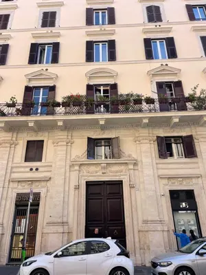 a white car parked in front of a building at Stylish 1BR, 2BATH Apartment Castel Sant'Angelo 6A in Rome