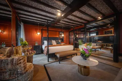 a bedroom with a bed and a living room at Pantheon Suite - Residenze di Charme in Rome