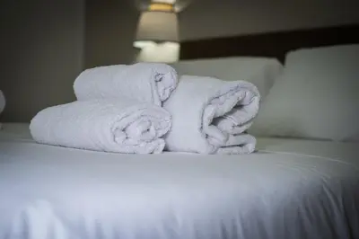 a pile of towels sitting on top of a bed at Pantheon Charming by Varental in Rome