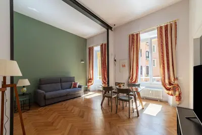 a living room with a couch and a table at GuestHost - Rione Prati Apartments in Rome