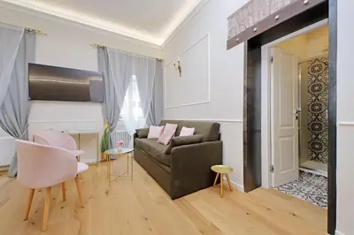 a living room with a couch and a table at Cozy new flat near the Station! in Rome