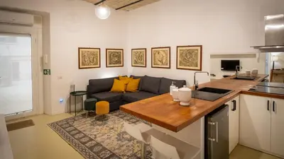 a living room with a couch and a table at Domus Oro nel cuore di Roma in Rome