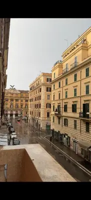 a view of a city street with buildings and cars at Niam House Volturno in Rome