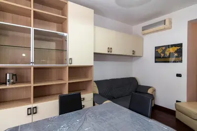a bathroom with a white sink and a mirror at Apartment Marconi 2833 in Rome