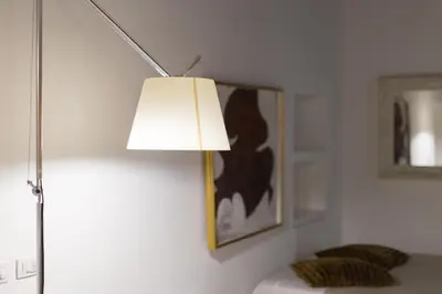 a white room with a lamp on a wall at Gold Spanish's Steps in Rome