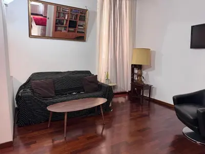 a living room with a bed and a table at Sanniti House in Rome