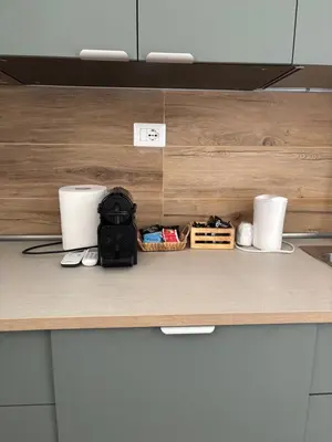 a kitchen counter with two paper towels and a phone at Last floor Aurelio Vaticano in Rome