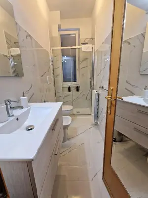 a bathroom with a toilet and a sink and a shower at Casa Claudia in Rome