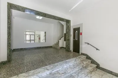 an empty hallway with a mirror and a door at BB Trastevere Station - Room1 in Rome