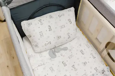 a bed with two pillows and a blanket at Gioele's Apartment in Rome