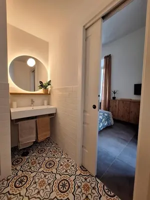 a bathroom with a sink and a mirror at Casa Sommeiller in Rome