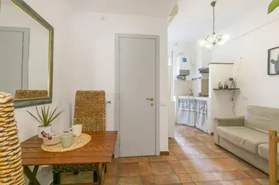 a living room with a table and a couch at BB Trastevere Station - Room2 in Rome