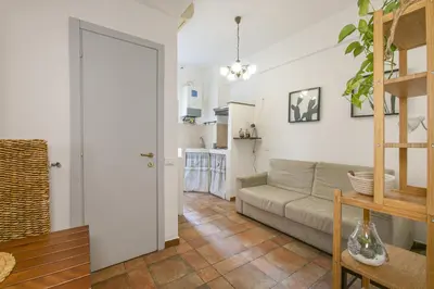 a living room with a couch and a table at BB Trastevere Station - Room2 in Rome