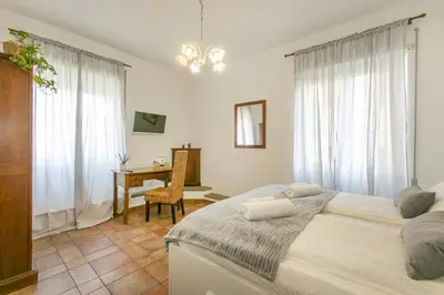 a bedroom with a bed and a desk in it at BB Trastevere Station - Room3 in Rome