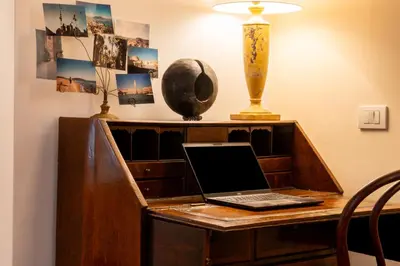 a desk with a laptop computer on top of it at Residenza a Monti in Rome