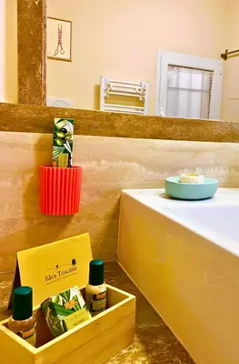a bathroom with a counter with a sink and a mirror at The Best Nest in Rome