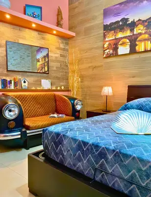 a bedroom with a bed and a couch at The Best Nest in Rome
