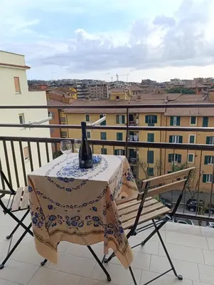 a table with a vase on top of a balcony at Casa Vacanze LaMatta Music House in Rome