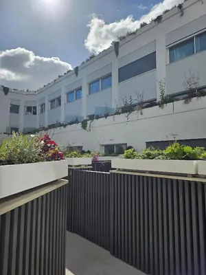 a building with plants on the side of it at Colosseum Luxury suite 41 in Rome
