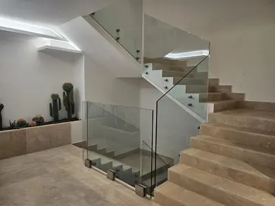a staircase in a house with a glass case at Colosseum Luxury suite 41 in Rome