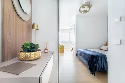 a room with a bed and a table with a plant at Colosseum Luxury suite 41 in Rome