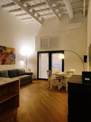 a living room with a couch and a table at Casa Beatrice, Trastevere in Rome
