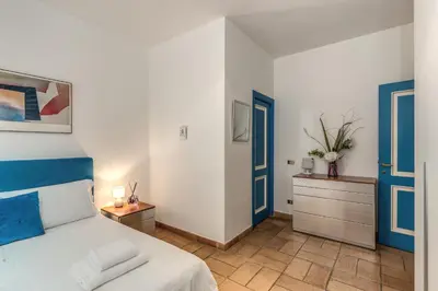 a bedroom with a bed and a dresser at La Casa di Taumasia in Rome