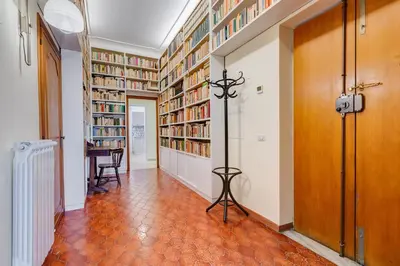 a hallway with a library with bookshelves at Terrace with a view of Rome in Rome