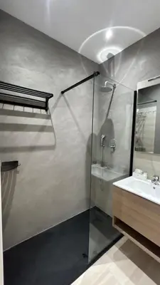 a bathroom with a glass shower and a sink at Antony house in Rome