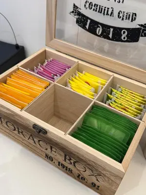a wooden box filled with different colored pencils at Re&x Home Rome Near Coloseum in Rome
