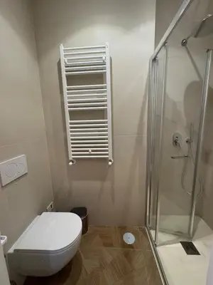 a bathroom with a toilet and a glass shower at Re&x Home Rome Near Coloseum in Rome