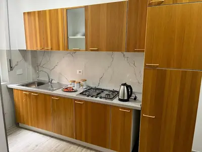 a kitchen with a sink and a stove top oven at Casa Jasmine in Rome