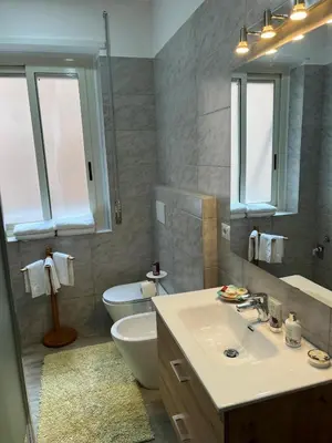 a bathroom with a sink and a toilet at Casa Jasmine in Rome