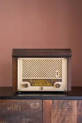 an old radio sitting on top of a table at B HOUSE - luxury apartment Trastevere in Rome