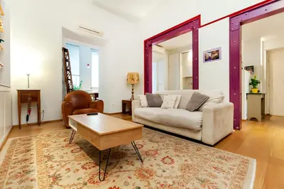 a living room with a couch and a table at River House in Rome