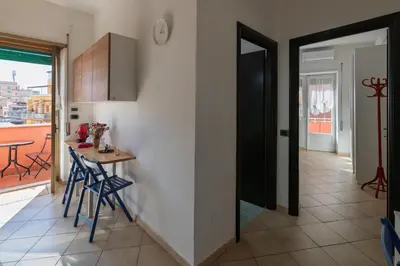 a kitchen and dining room with a table and chairs at Pigneto Apartment in Rome